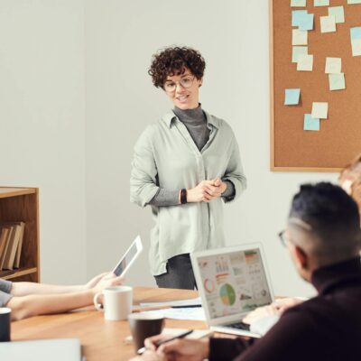 Woman Wearing Gray Cardigan and Eyeglasses